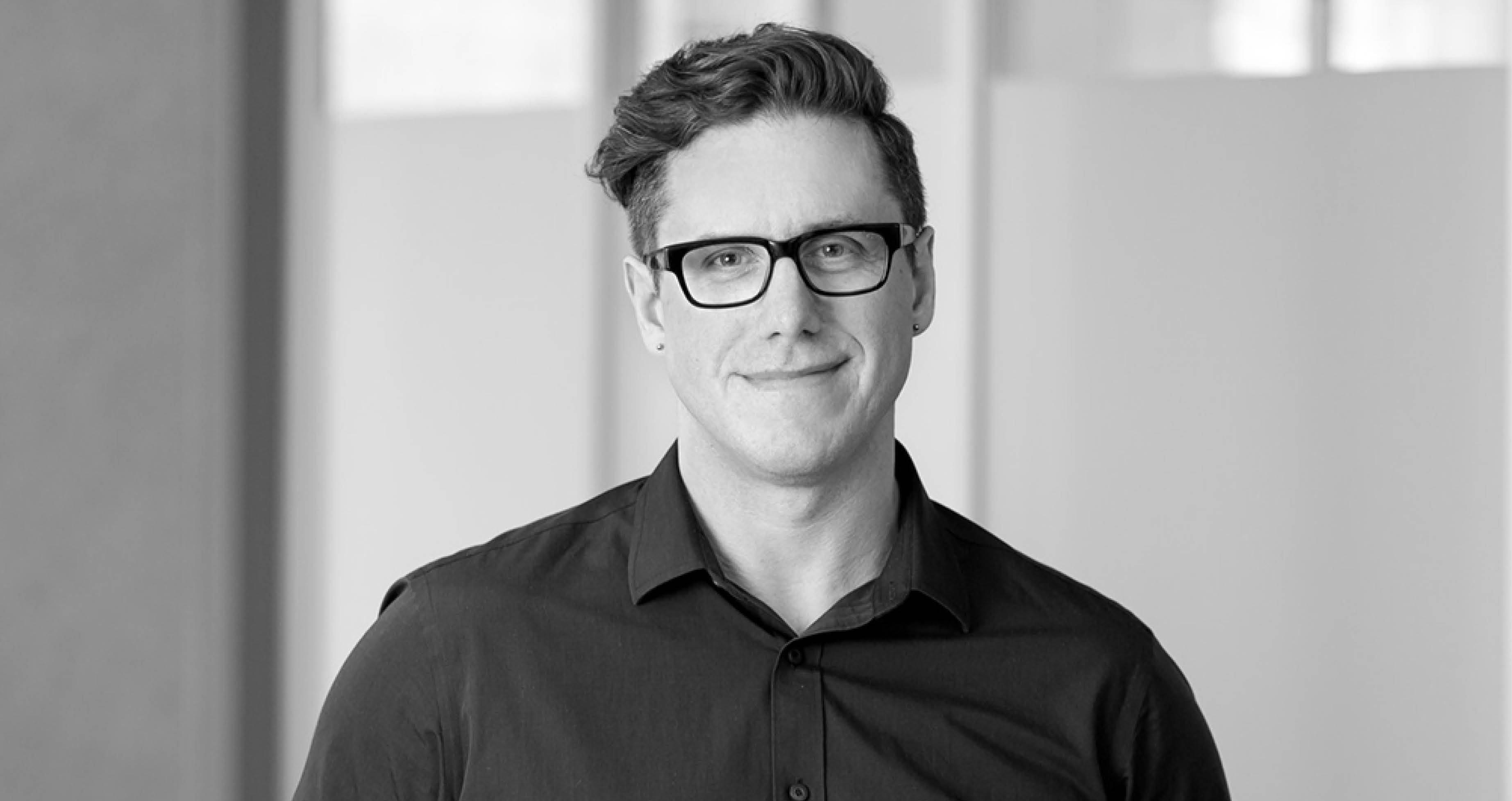 Black and White headshot of Russell Higgins