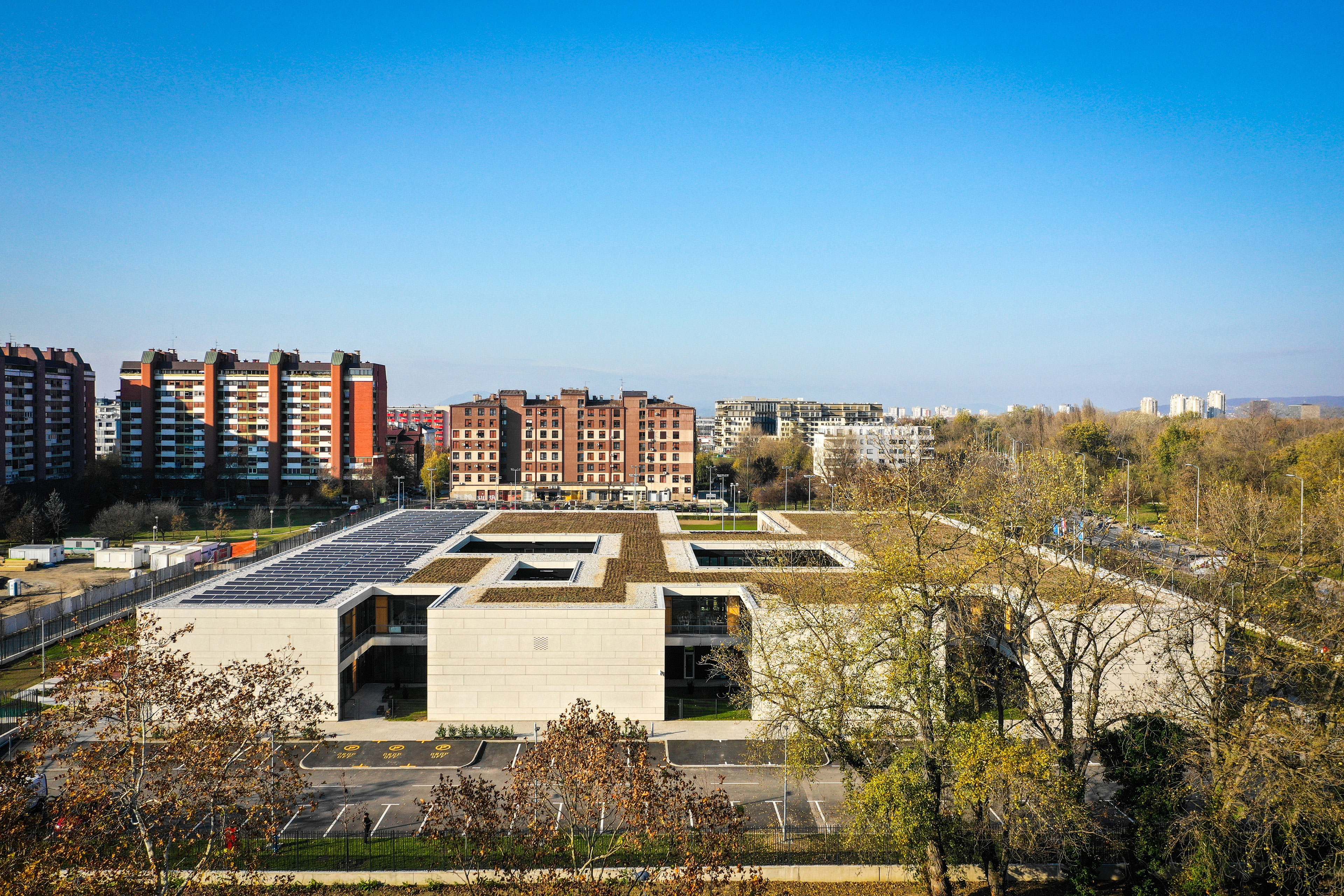 Aerial of American International School of Zagreb with trees to the right