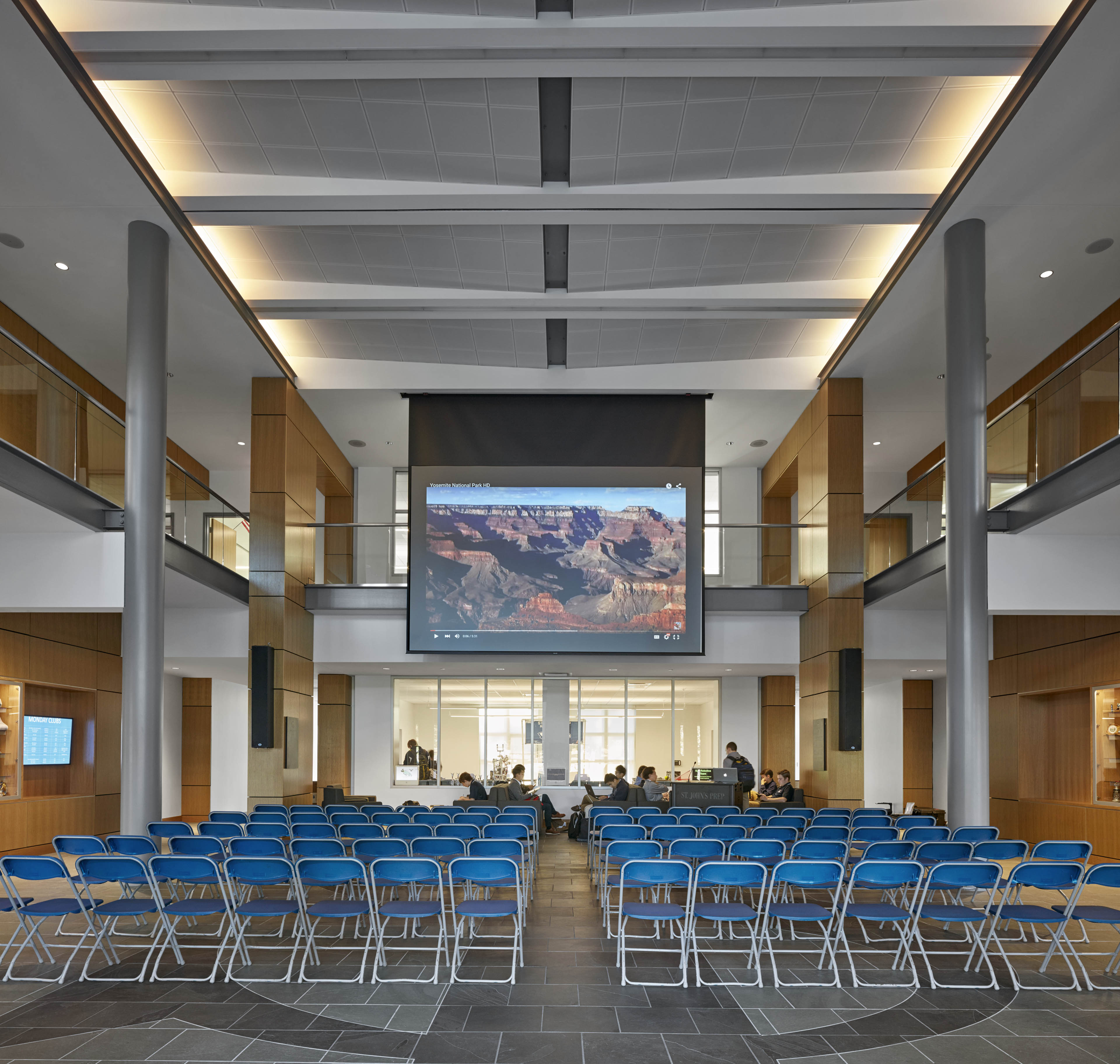 Chairs in common area set up in front of projector 