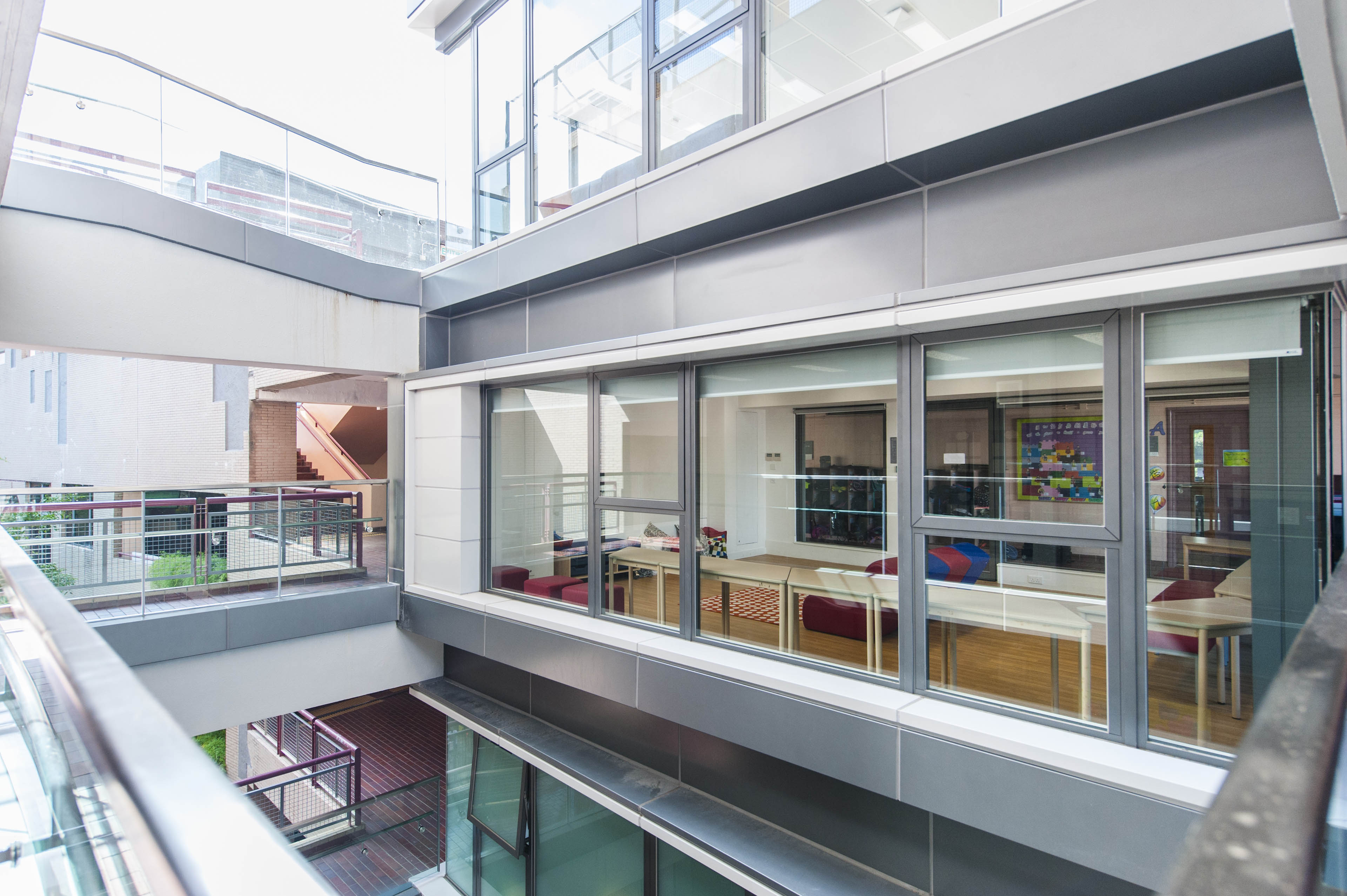 View of classroom with large windows from balcony 