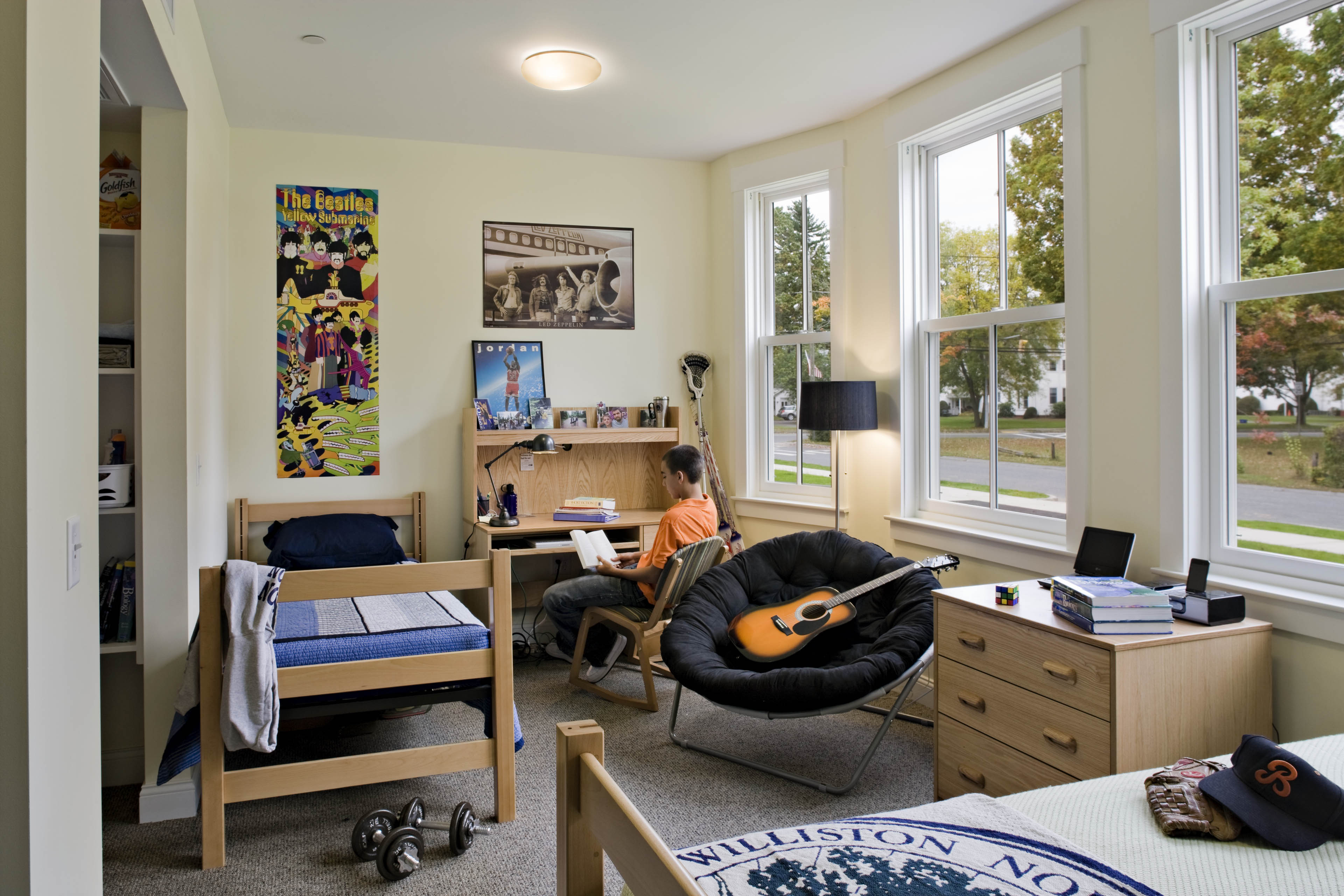 Interior dorm room with window on the right looking out to the quad