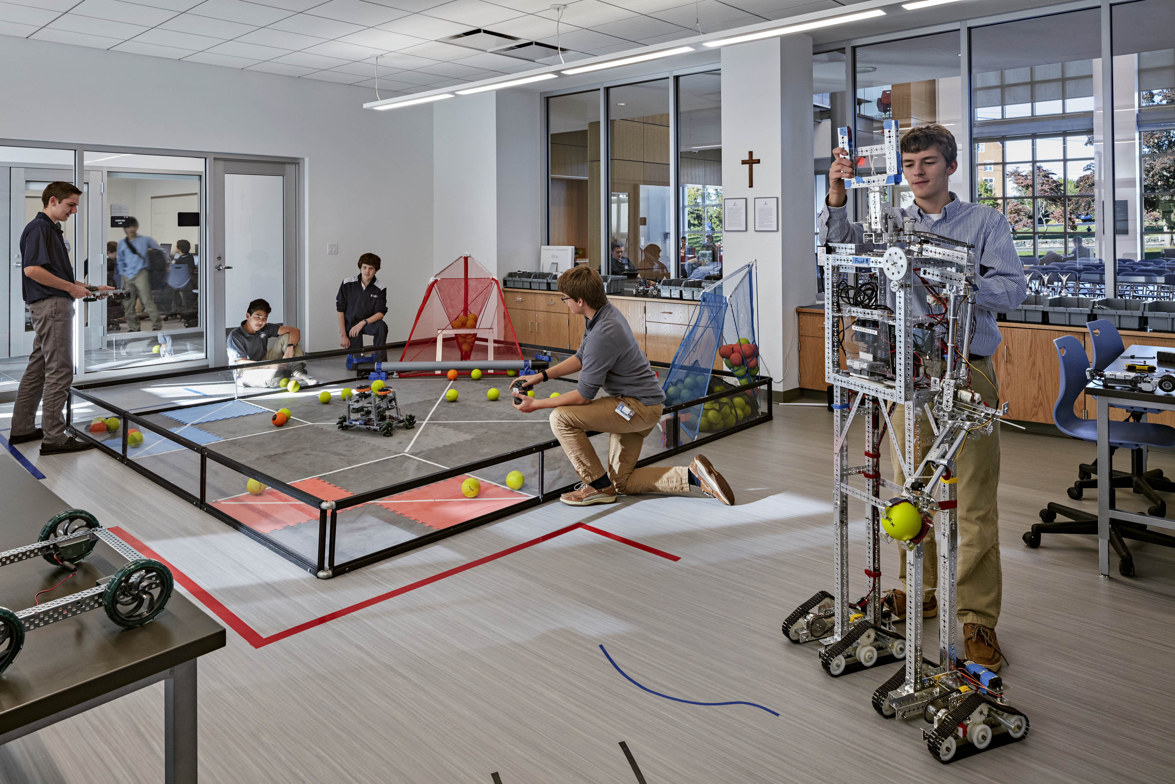 Students playing with robots in robotic lab