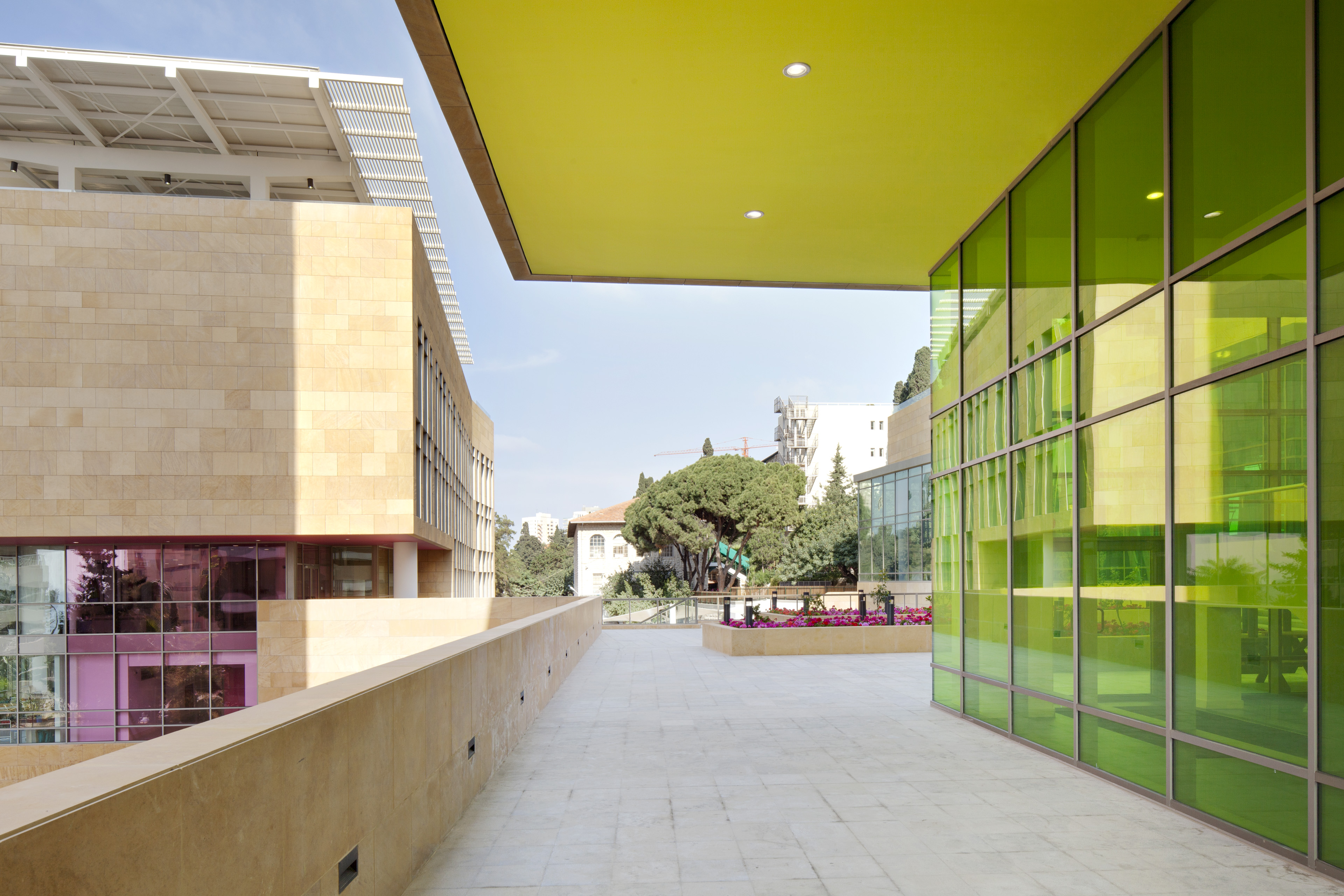 View of awning above walkway with green ceiling and green windows to the right