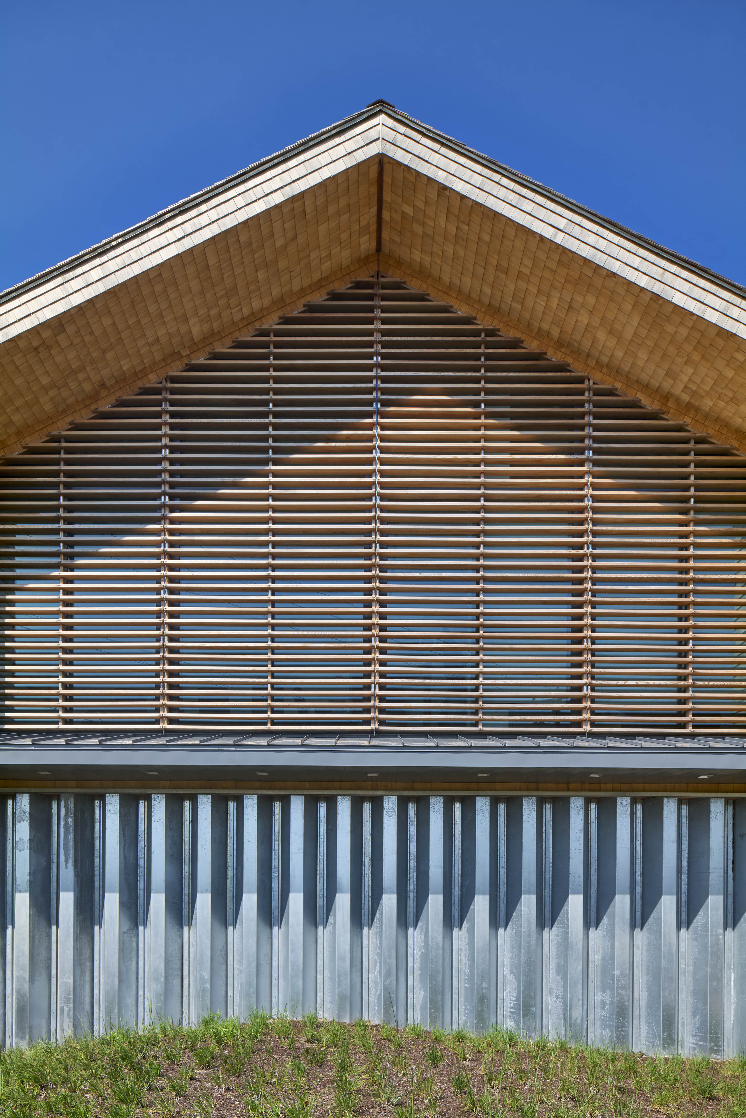 Exterior of second floor with slats and ceiling at its peak
