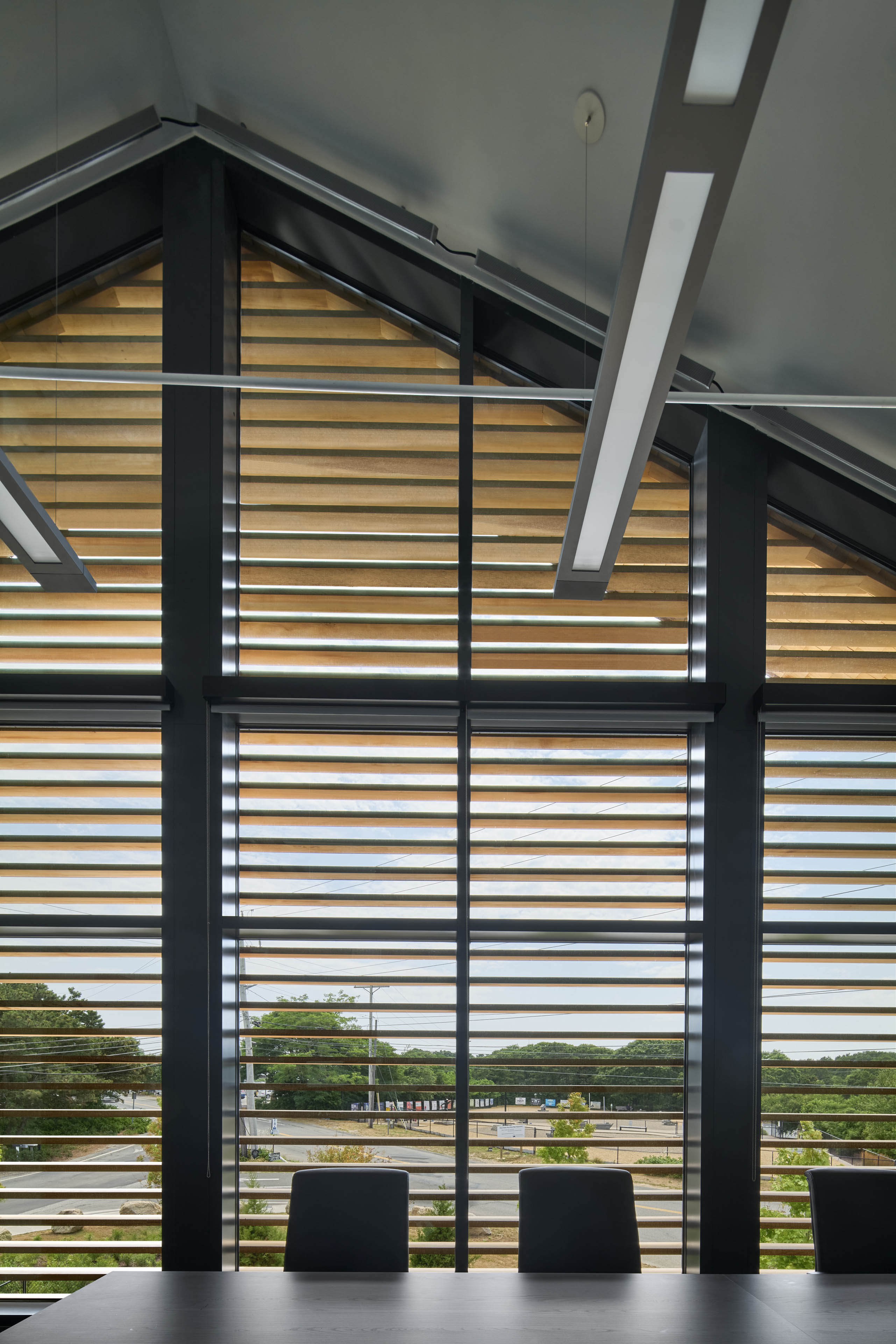 View from second floor of building looking out through slats 