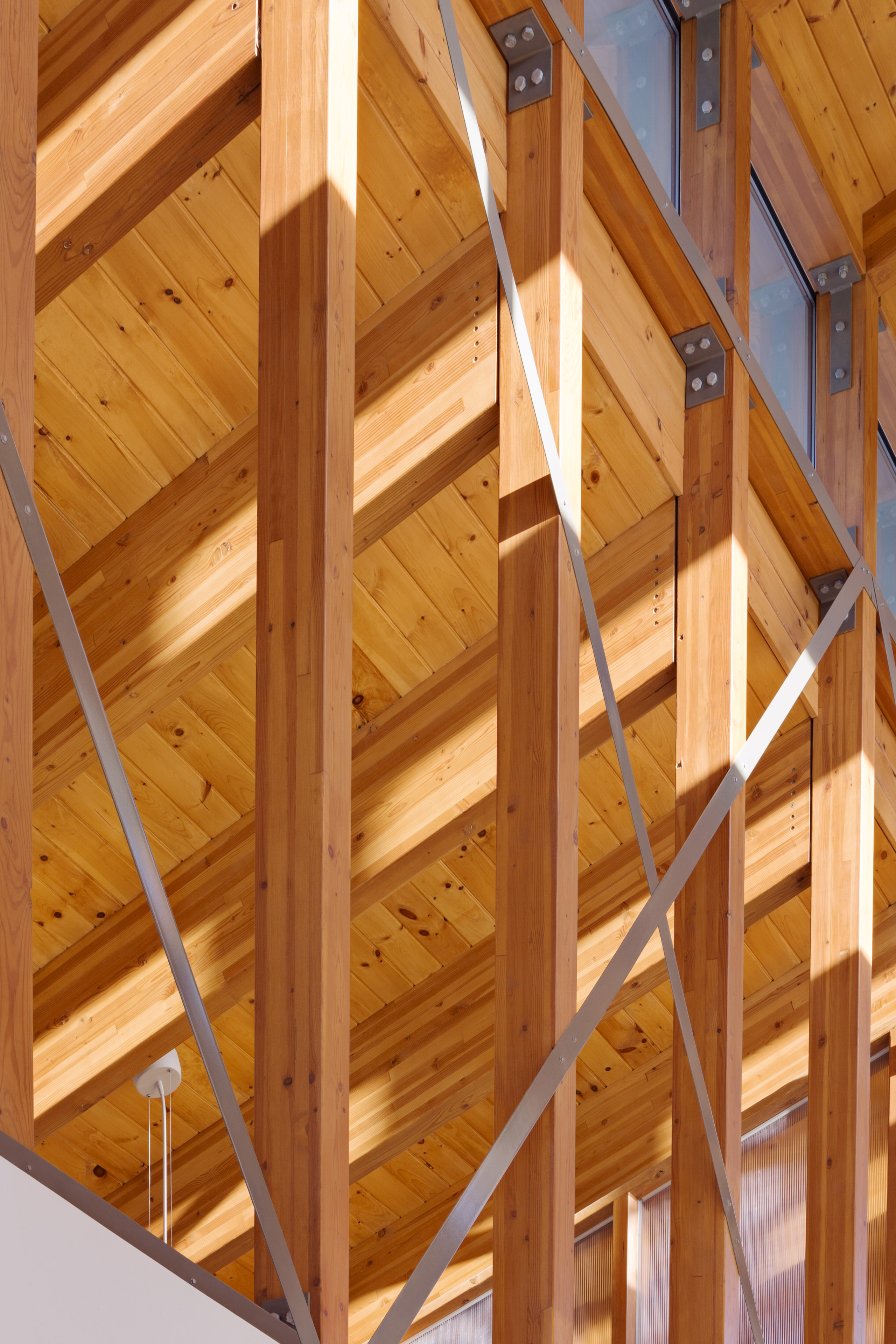 Wood beams with metal sheets in x formation